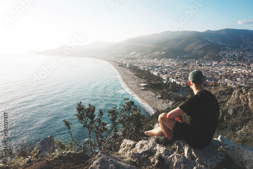 Sportsman on the view point over a beach and city skyline - Alanya (Turkey).