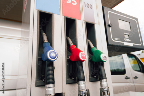 Refueling gun various colors close-up. Gas and oil station with diesel and gasoline fuel.