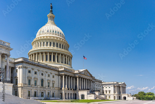 The United States Capitol building with American flag, Washington DC, USA.