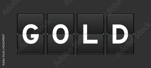 Black color analog flip board with word gold on gray background