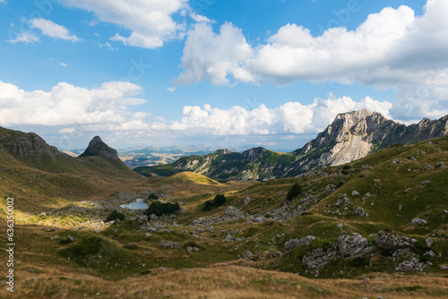 Panoramic views on the rocky mountain landscapes from a hike from the Sedlo Pass to the peak of Bobotov Kuk, Montenegro photo