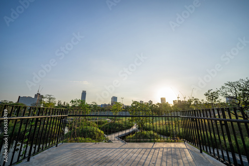 Twilight time at Benchakitti park, famous park in Bangkok, Thailand. You can see the balcony and a whole view of the park in this silhouetted picture. photo