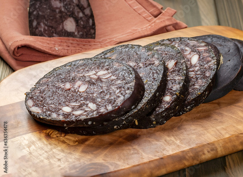 Morcilla de Burgos is a sausage made from rice and pork blood, onion, lard, salt, pepper, paprika, oregano. Tapas typical of Spanish gastronomy. photo