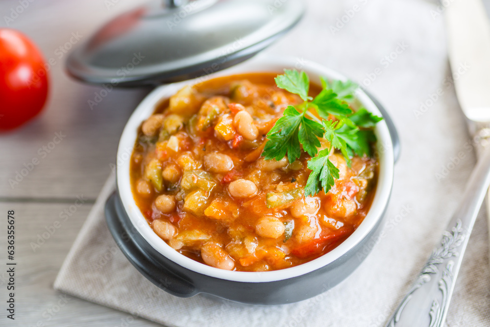 Cooked white beans with zucchini and other vegetables. Cooked white beans with zucchini and other vegetables.