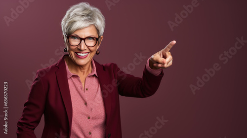Senior woman wearing casual clothes pointing with hand and finger to the side looking at the camera.