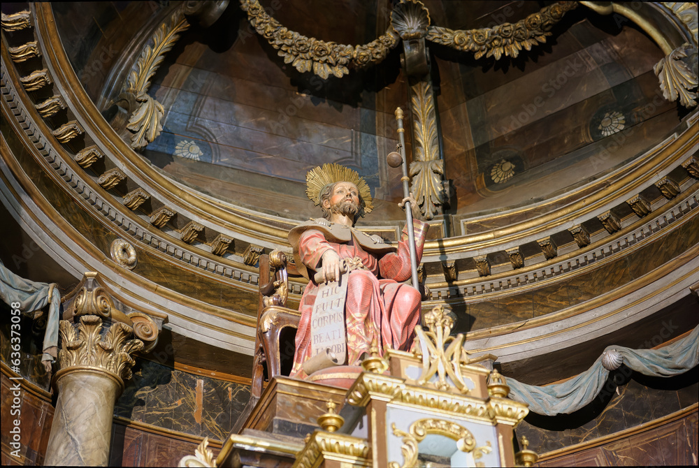 Fototapeta premium polychrome sculpture of the baroque altar with the image of Saint James the Greater on his throne dressed as a pilgrim heading to Santiago de Compostela