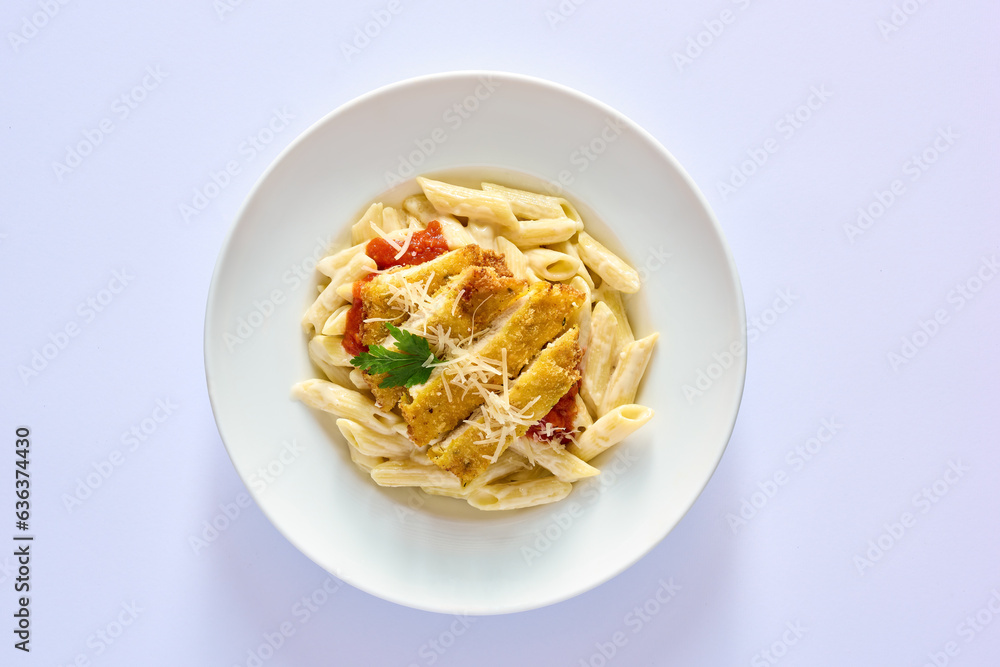 Penne pasta with red sauce, chicken strips, and shredded parmesan, top view on white background