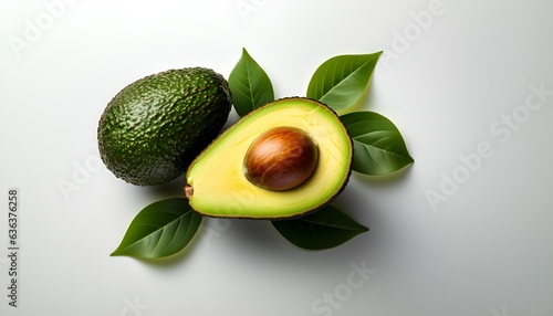 Avocado cut in half on a solid white background top view