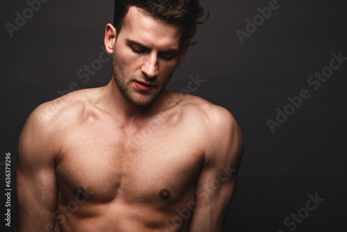 Male beauty concept. Portrait of handsome young man. Perfect hair and skin. Studio shot