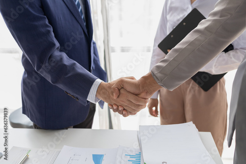 Wallpaper Mural Two business men shake hands, Two businessmen are agreeing on business together and shaking hands after a successful negotiation. Handshaking is a Western greeting or congratulation. Torontodigital.ca