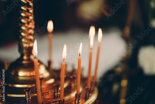 Canvas Print burning candles in church
