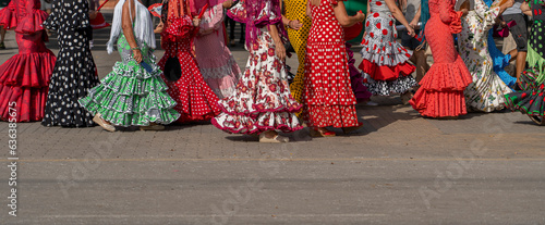 The essence of Andalusian culture captured in a vibrant flamenco dress adorned with polka dots. An emblem of Spanish dance and festive celebrations, oozing traditional flair. photo