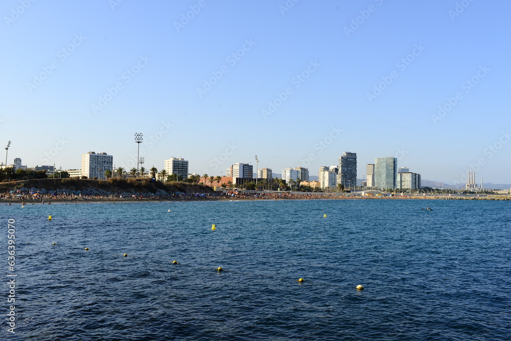 view of urban infrastructure against the background of the sea on a summer day