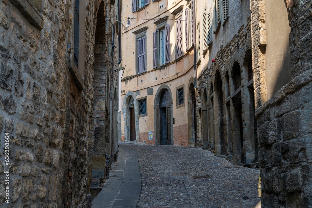 Narrow stone street in historical Bergamo, Italy