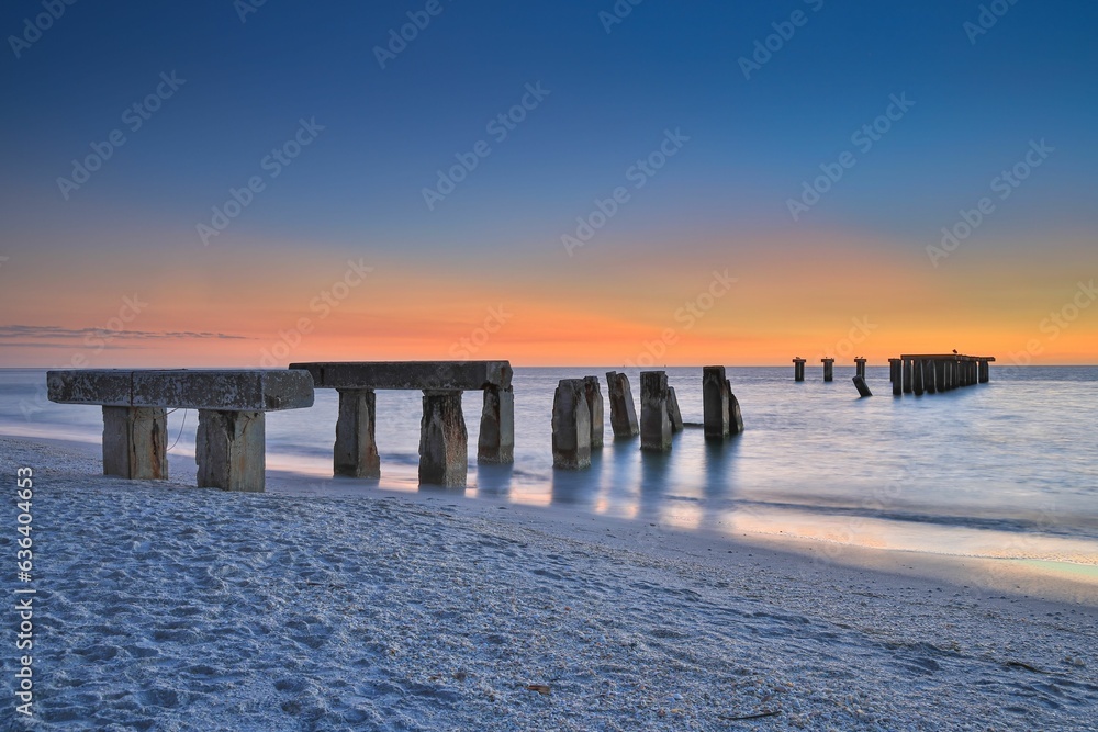 Old broken pier on the Florida island of Boca Grande just after sunset.