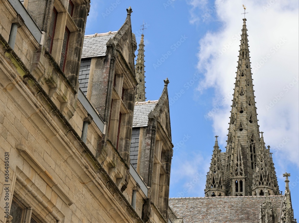 Quimper, a city in Britany, France. Top of the tower of the cathedral and parts of old houses