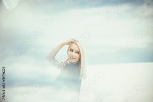 Beautiful blonde women posing in band AC/DC shirt at Utah Salt Flat photo