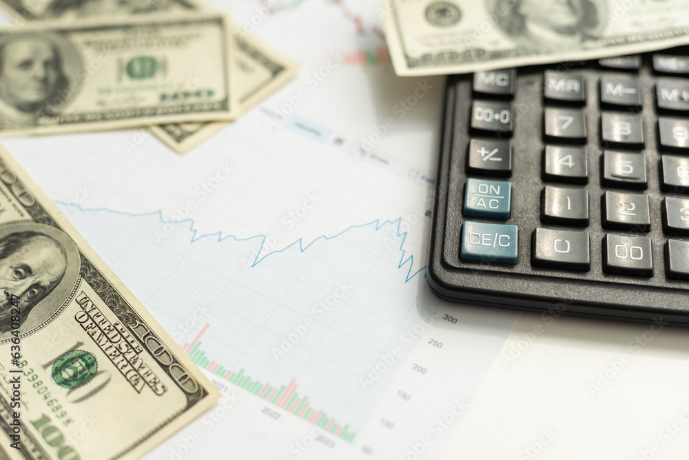 Business concept with graphs. A bundle of money on a graph. Business concept with graphs. A bundle of money on a graph.