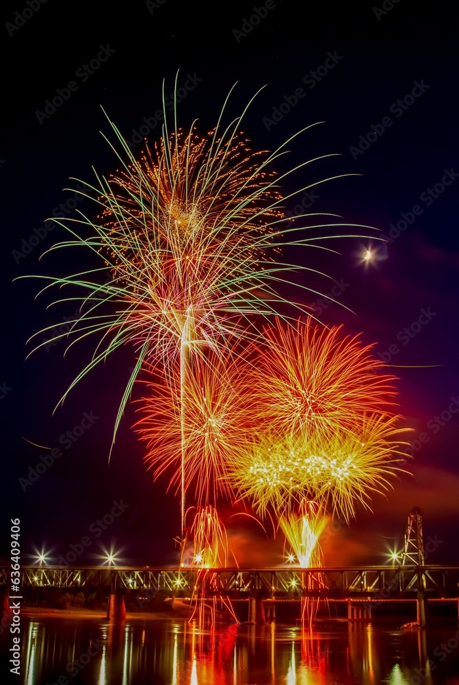 Vibrant festive fireworks over the Meridian Highway Bridge at night Vibrant festive fireworks over the Meridian Highway Bridge at night