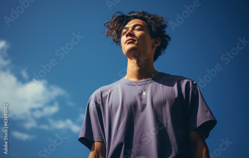 Contrasting Hues of Labor: Young Man in Slumped T-Shirts, Marrying Dark Blue and Sky-Blue, Exemplifying Laborwave, Organic Minimalism, and Carpetpunk Aesthetics photo