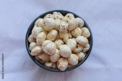Fox Nuts also known as Makhana. Lotus seeds. kamal ka phool. Indian fried snacks and dry fruits concept. selective focus photo