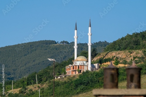 A beautiful isolated mosque with two tall minarets, built on a hill near the city of Prizren, Kosovo