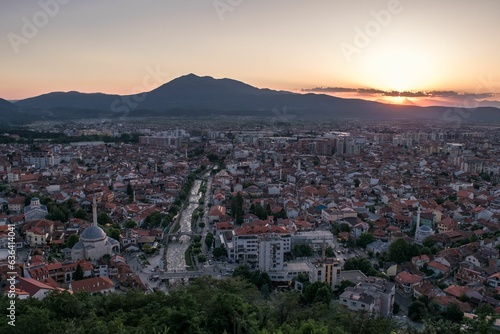 Elevated cityscape view of the city of Prizren, Kosovo, during sunset on a summer day. © James Attard/Wirestock Creators