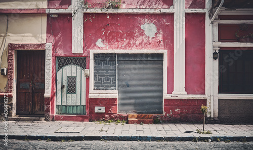 Street view of an old building facade, architecture background, color toning applied, Riobamba, Ecuador. photo