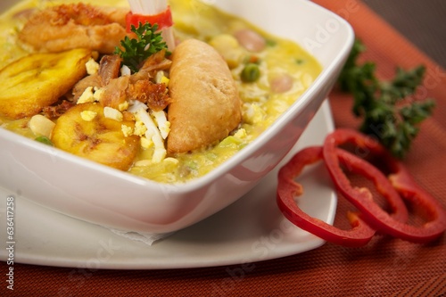 photography of a traditional ecuatorian soup called Fanesca and mashed potatoes photo