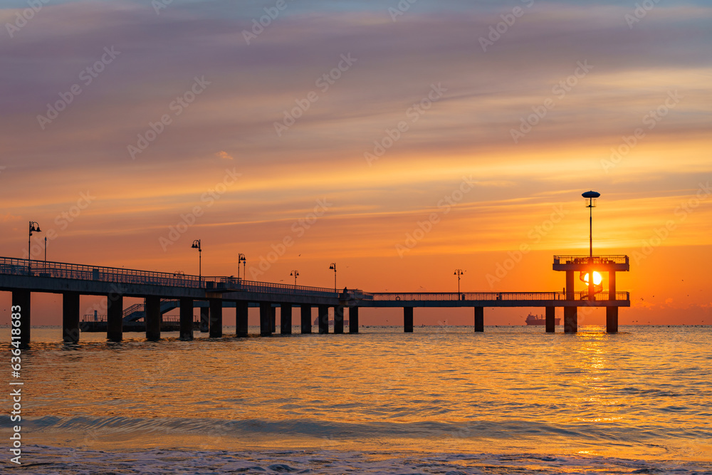 Silhouette shot of the Bridge in Burgas with a golden sunset over the sea Silhouette shot of the Bridge in Burgas with a golden sunset over the sea
