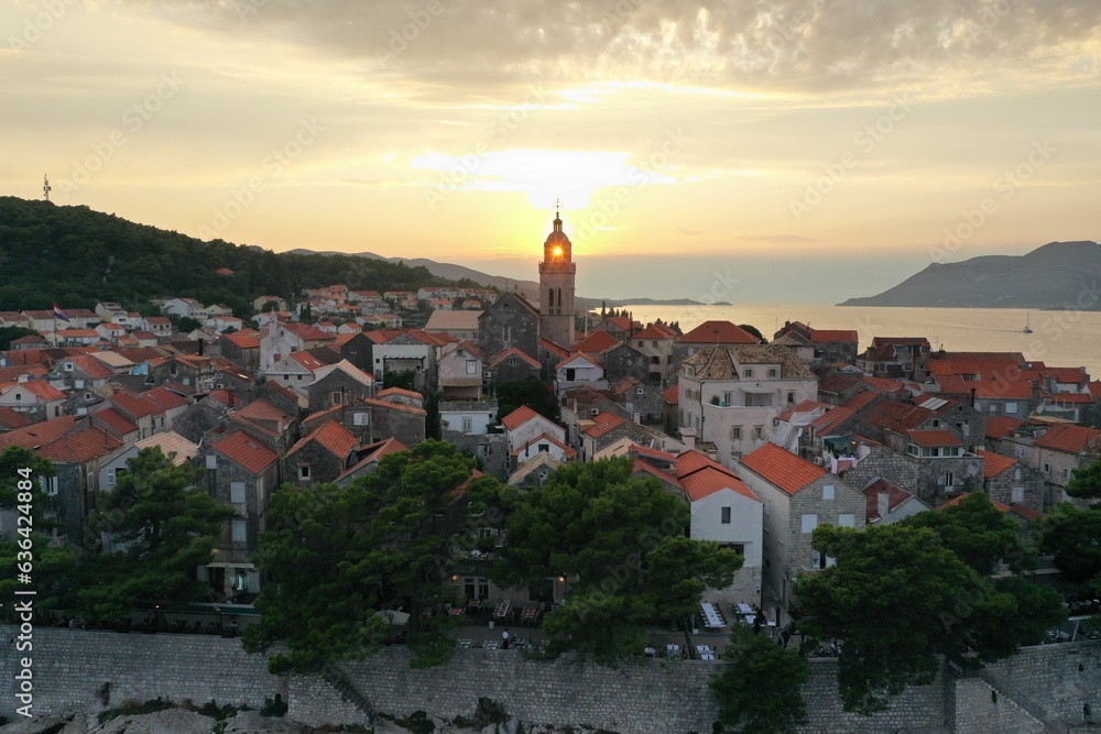 Scenic aerial view of a vibrant town with a stunning blue sea in the background in Croatia