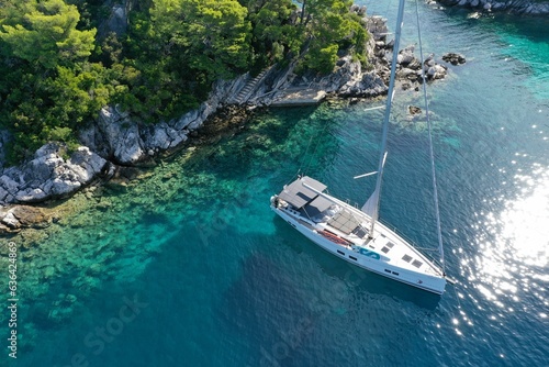 Hanse yacht anchored in a beautiful private bay in Croatia photo
