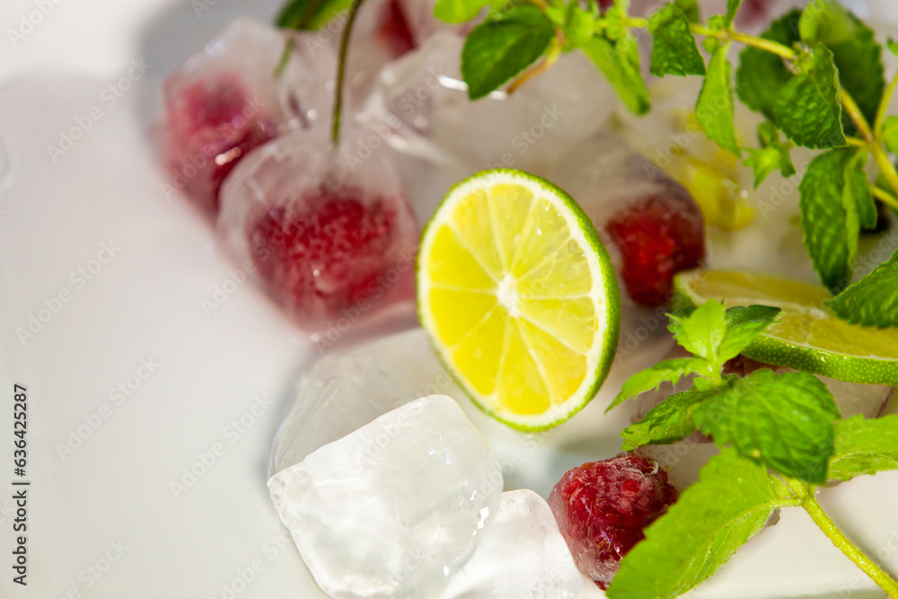 Slice of fresh lime. Cold cocktail ingredients. Close-up, selective focus, copy space.