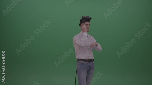 Young Man Wearing White Shirt Making Hard Decision Using Virtual Glasses To Solve The Task, Green Screen Wall Chroma Key Background (ID: 636435062)