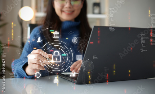 Cybersecurity technology concept. A person is using a computer with data privacy protection from digital threats. Protect system hardware, software and applications Connect to work on the Internet.