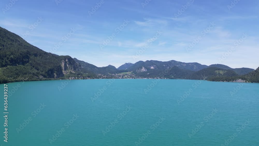 Drone view over an azure sea between forested mountains Drone view over an azure sea between forested mountains
