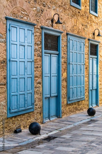 Beautiful view of blue windows and doors at the street