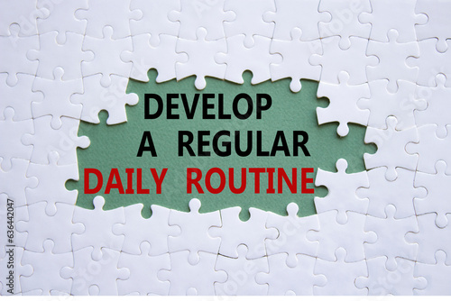 Daily routine symbol. Concept words Develop a regular daily routine on white puzzle. Beautiful grey green background. Business and Develop a regular daily routine concept. Copy space.