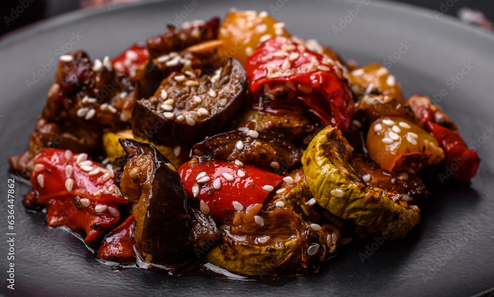 Delicious juicy fresh salad of baked eggplant, tomatoes, sweet peppers, sesame seeds Delicious juicy fresh salad of baked eggplant, tomatoes, sweet peppers, sesame seeds