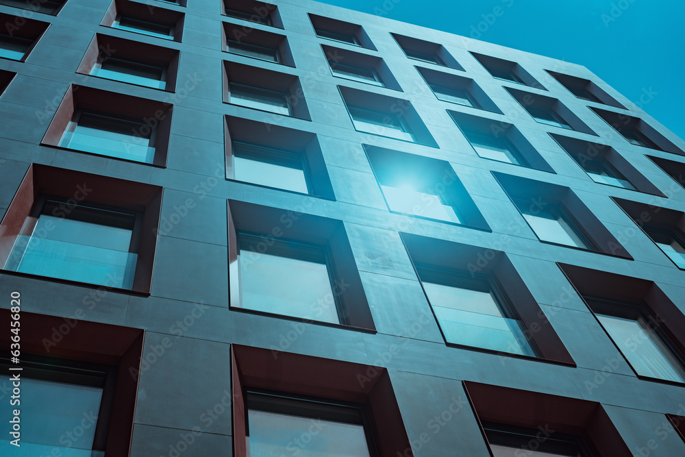 Facade of modern building, blue tint, bright sunlight Facade of modern building, blue tint, bright sunlight