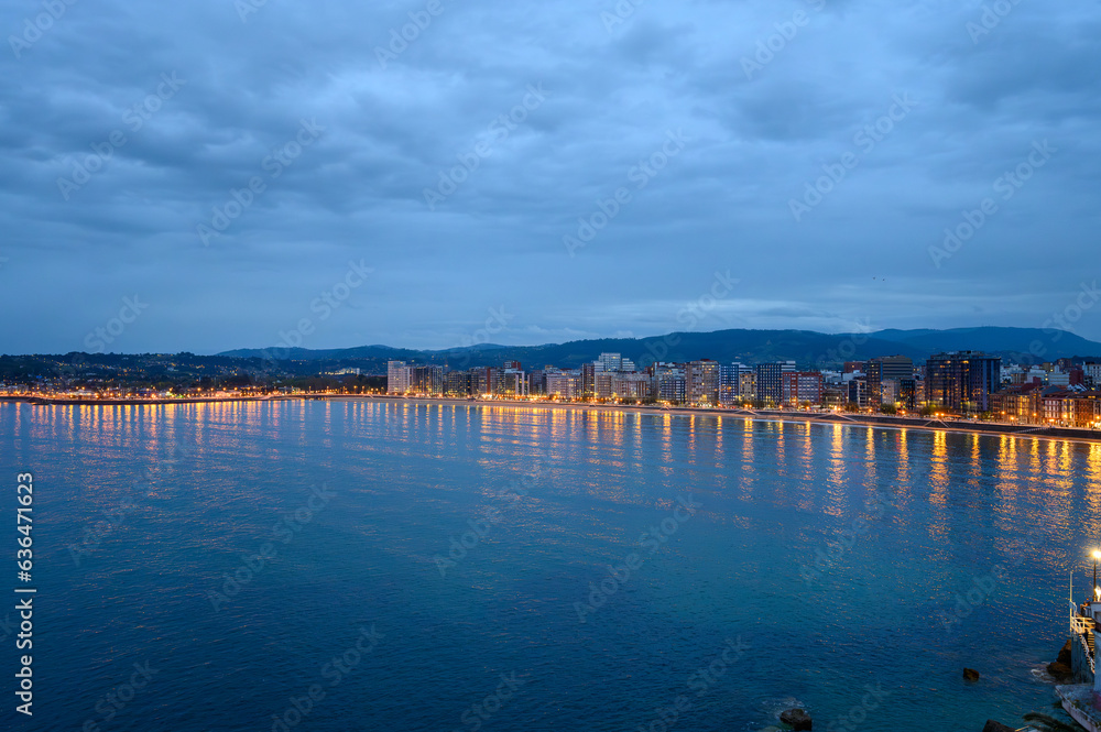 Evening view on houses and San Lorenzo beach in Gijon, Asturias, Spain