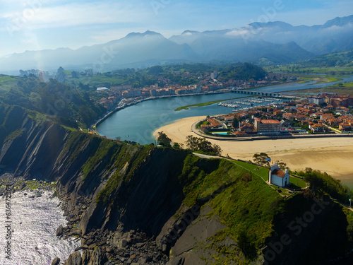 Aerial panoramic view, vacation on Costa Verde, Green coast of Asturias, Ribadesella village with sandy beaches, North of Spain photo