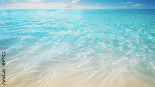 Crystal clear turquoise seawater gently laps against the white sand
