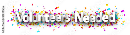 Volunteers needed sign over colorful cut out ribbon confetti background.