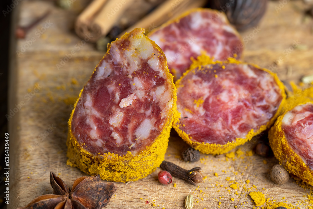 Sliced pork salami with spices and lots of turmeric Sliced pork salami with spices and lots of turmeric