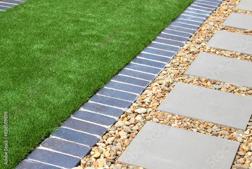 Modern Backyard Design with Artificial Grass, Rocks, and Tiles