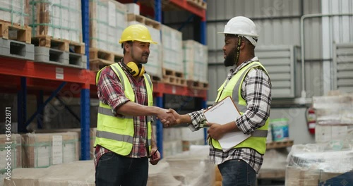 Wharehouse worker handshaking after finish job