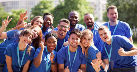 Cheerful Volunteer Team In Park