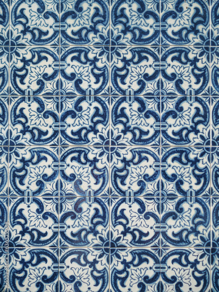 Close-up of a wall tiled with handmade vintage tiles from Portugal. Beautiful blue and white tones. Tradition concept