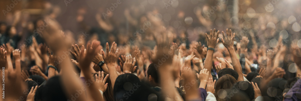 Christian worship with praise to God Ready to raise your hand at the Christian music concert, Holy City. copy space event - obrazy, fototapety, plakaty 
